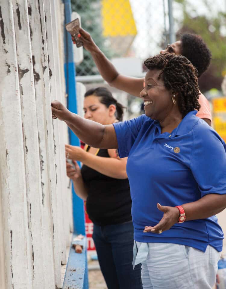 Mary Ferris (right), of the Rotary Club of Detroit, scrapes paint from the facade of Irma Fuentes' hardware store in Detroit, Michigan, USA, 25 July 2014. Rotarians from Detroit area clubs donated money and labor to assist with these improvements. Fuentes is one of 13 participants in the inaugural LaunchDETROIT program. LaunchDETROIT, a project of Rotary District 6400, offers entrepreneurs and small business owners in the Detroit area free business training, microloans, business mentoring, and networking opportunities.