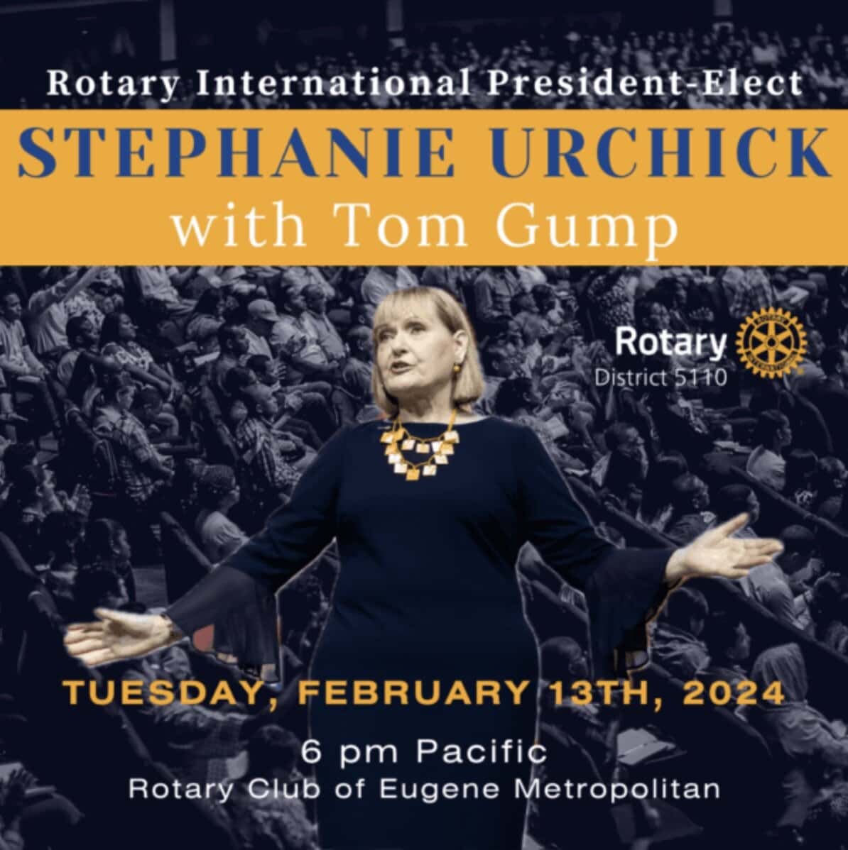 Stephanie Urchick addresses a crowd with outstretched hands. She has shoulder-length blond hair. She's wearing a black dress with a statement necklace.