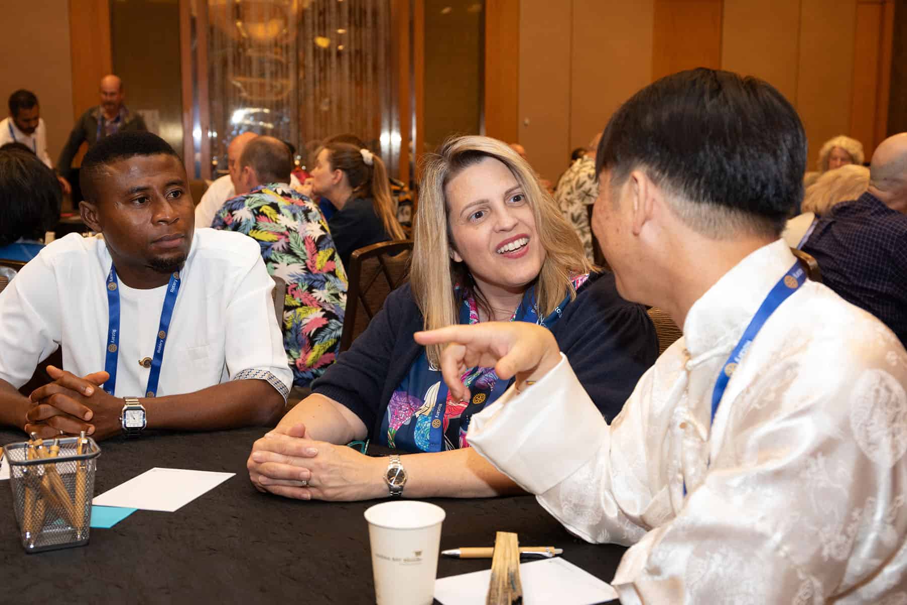 Rotarian engage in fellowship at a recent district conference.