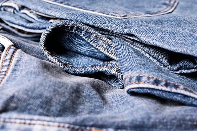 Close-up photo of a pair of jeans.